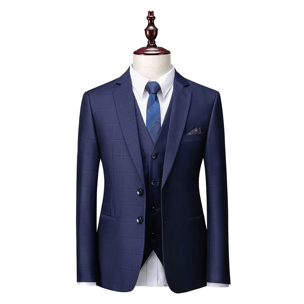 Men's navy blue three-piece plaid suit with slim fit design on hanger