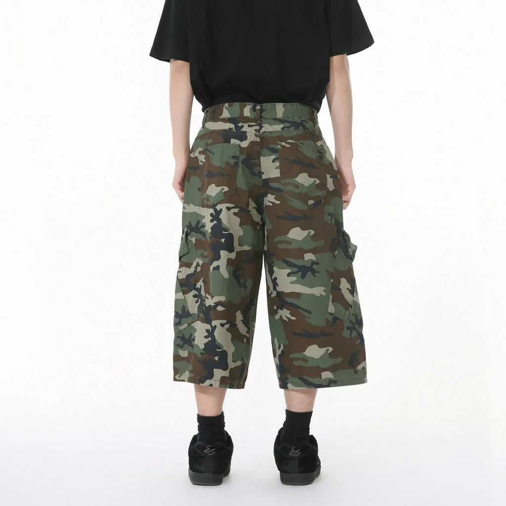Men's cotton camouflage cargo trousers showing wide leg fit, large pockets, and side stitching details