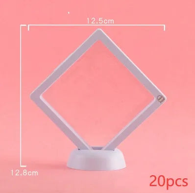 Transparent 3D floating display case holding a coin, with black and white size options