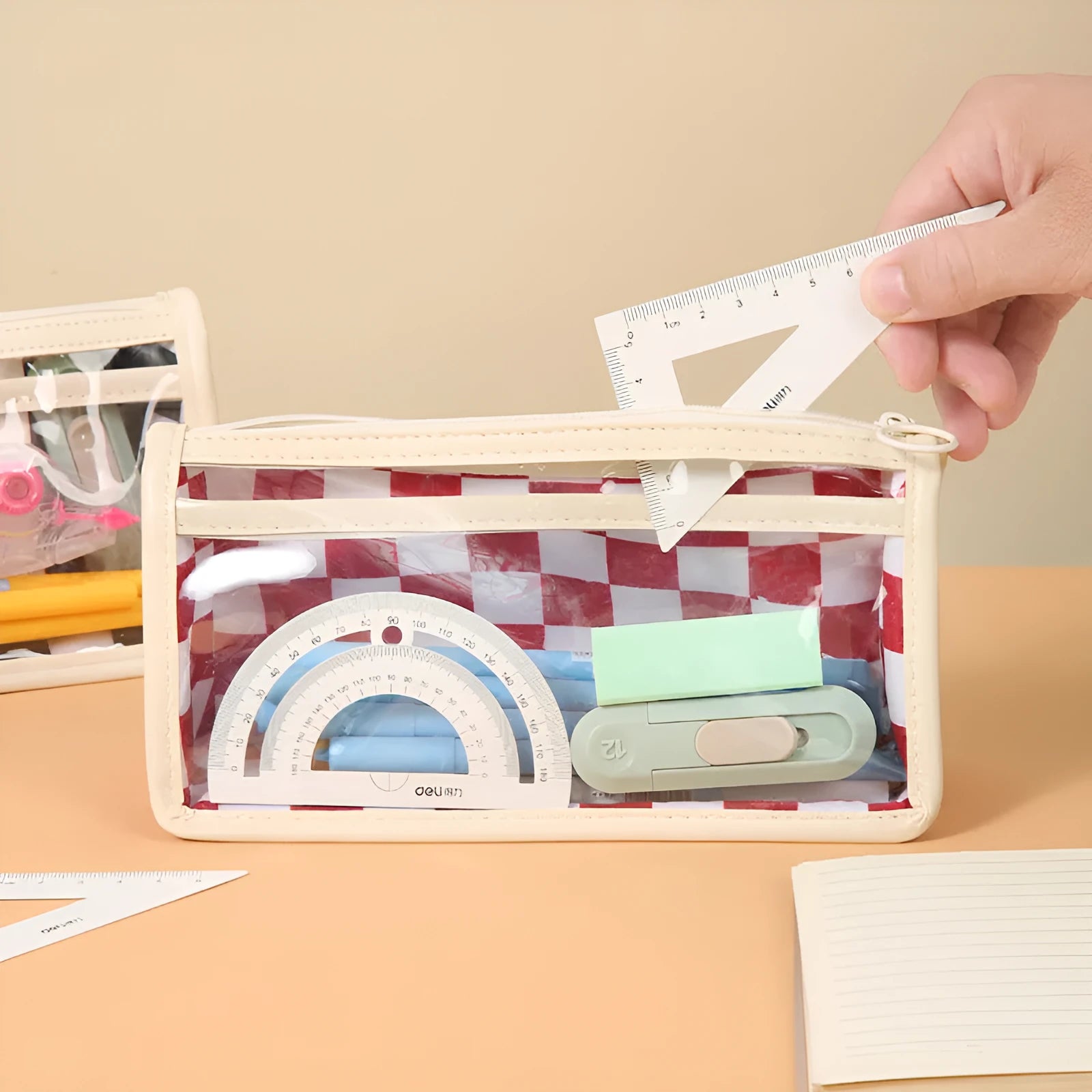 Transparent PVC pencil case with chessboard pattern measuring 21.5cm, shown in black and white grid design