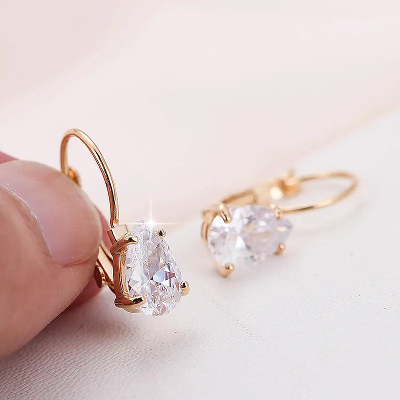 Drop-shaped copper earrings with platinum gem decoration in gold and platinum colour options