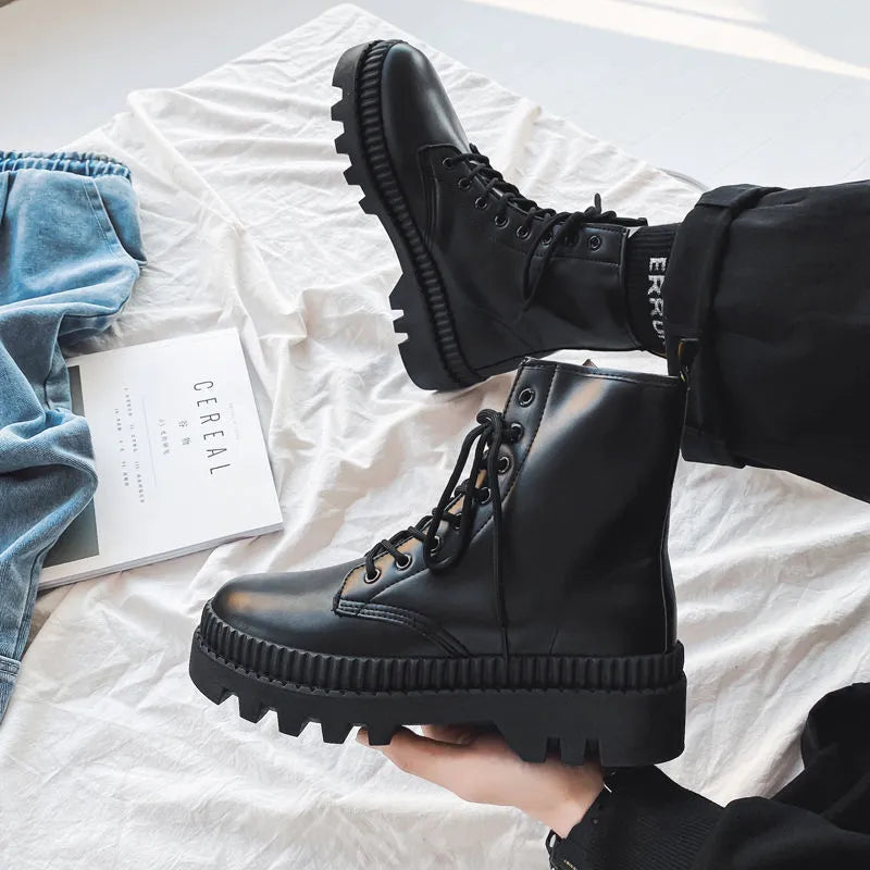 Men's black Doc Martens platform ankle boots with zip and frosted leather.