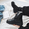 Men's black Doc Martens platform ankle boots with zip and frosted leather.