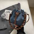 Blue one-shoulder cross body bucket bag with sandwich pocket compartments