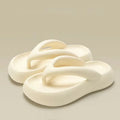Solid colour thick-soled EVA flip-flops with a bow detail on the upper.