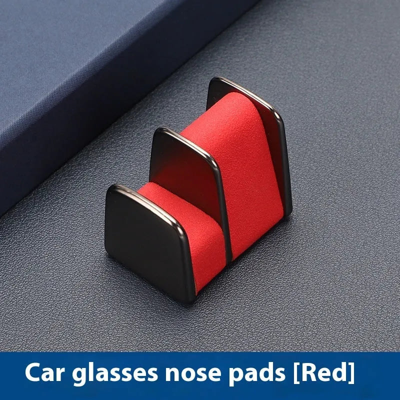 Green zinc alloy and leather glasses clip holder for car dashboard.