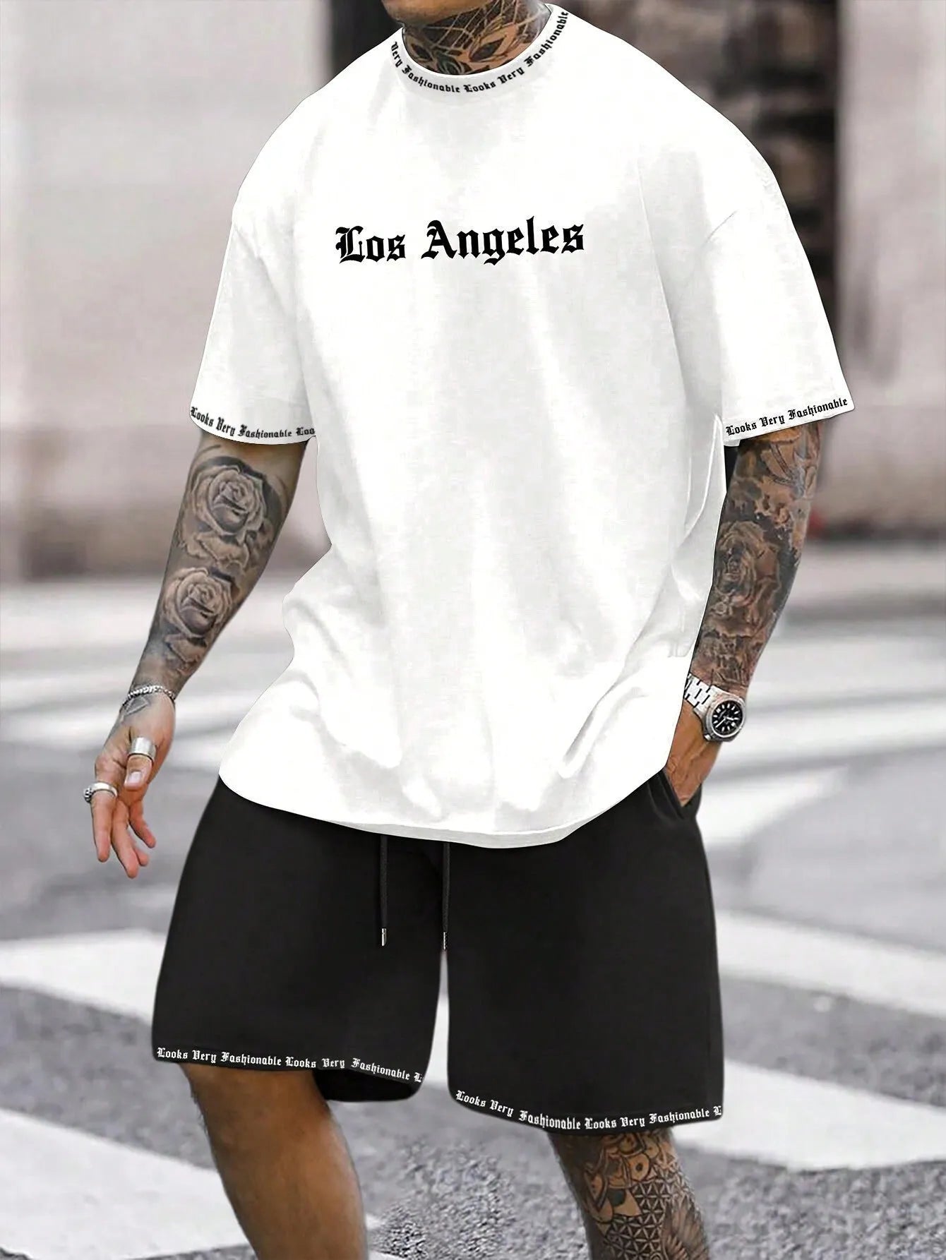 Men's navy blue printed short-sleeved top and matching shorts sports set on a white background