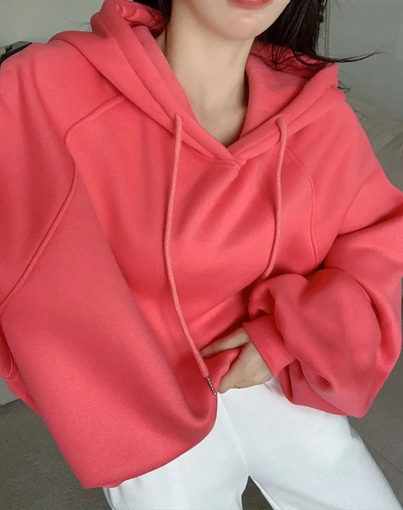 Watermelon red sleeveless women's hooded sweater made from mulberry silk, shown on a hanger.