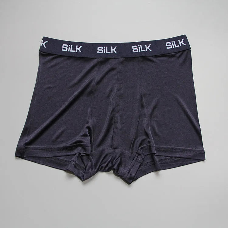 Men's silk shorts in loose fit design showing navy blue, silver grey, and skin colour options