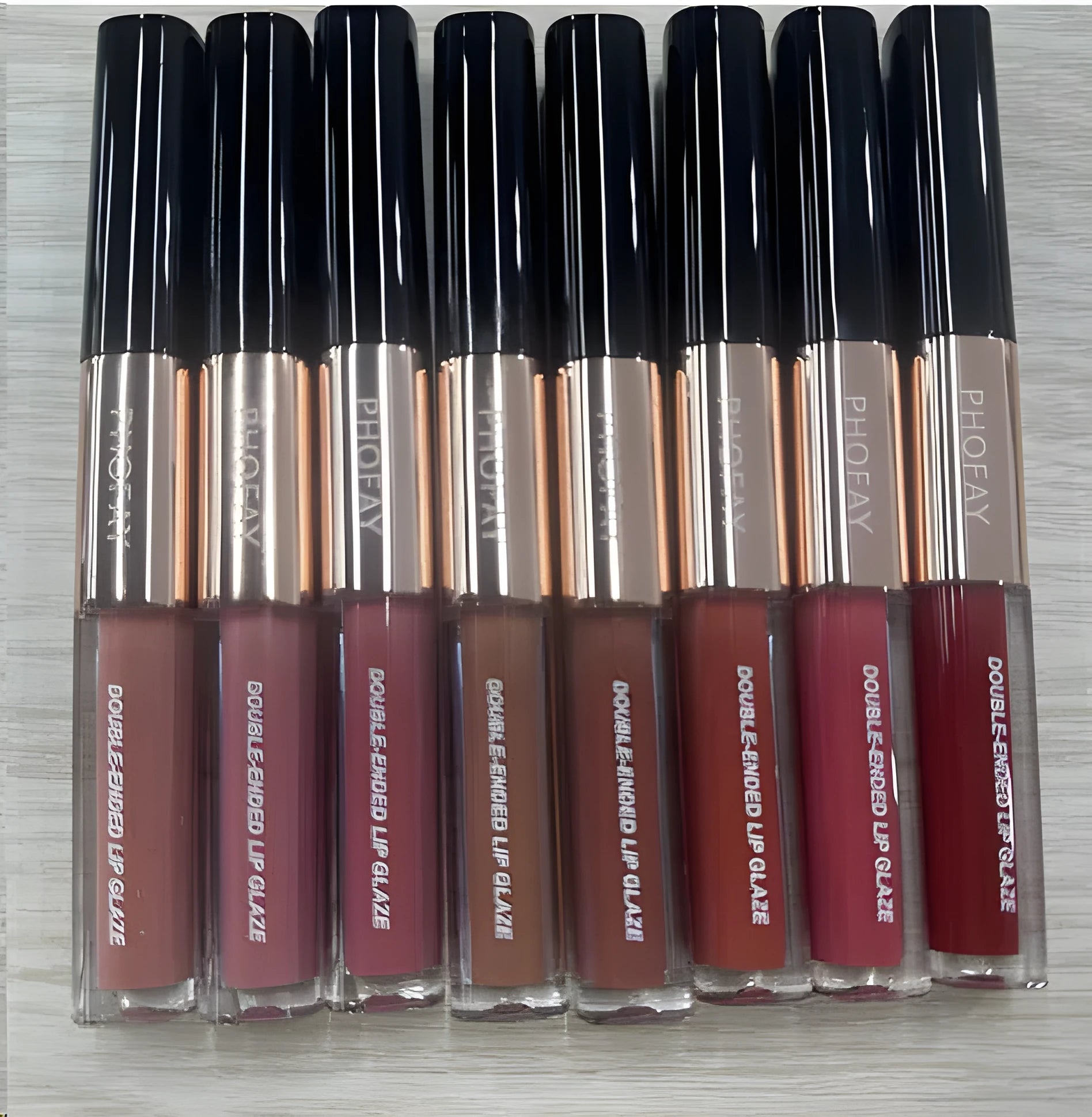C-L021 double-headed lip gloss showing two different applicator tips and non-stick formula.