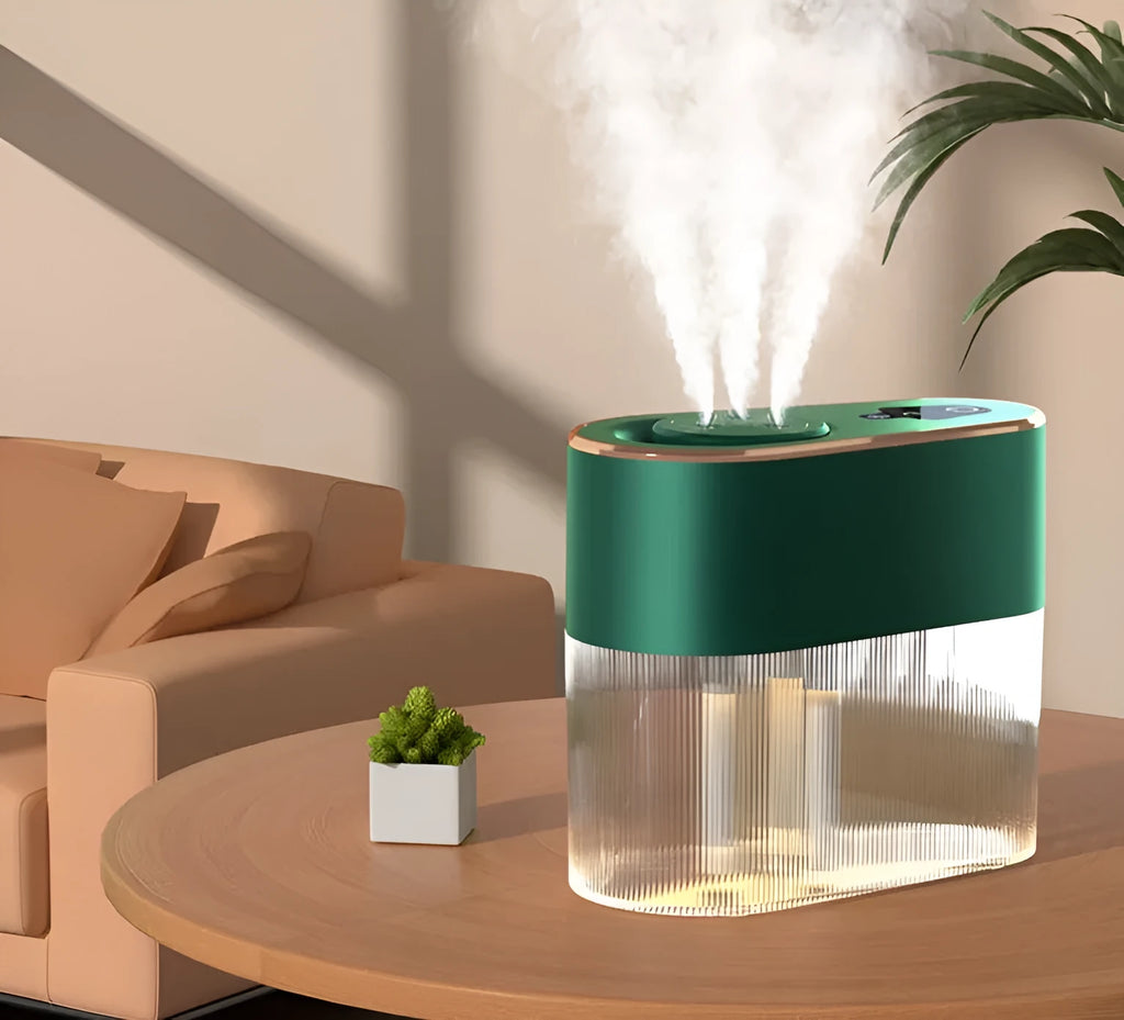 Electric three jet humidifier in blue with USB cable, 1.0-2.5L tank, and atmosphere lamp on a bedroom desktop