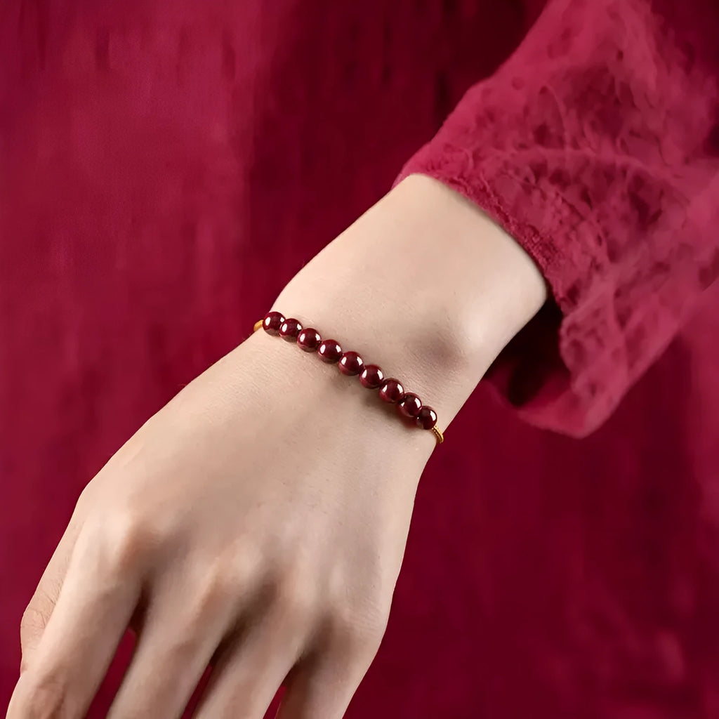 Hand-woven natural cinnabar bracelet with simple geometry shape on light background