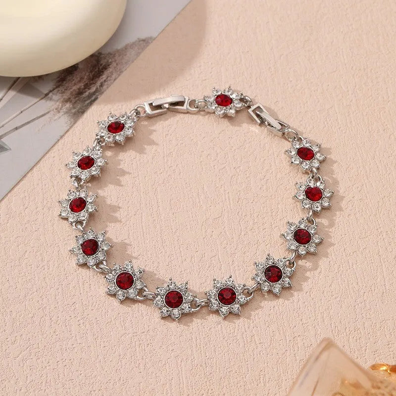 Women's zinc alloy floral bracelet with electroplated finish showing colour variations