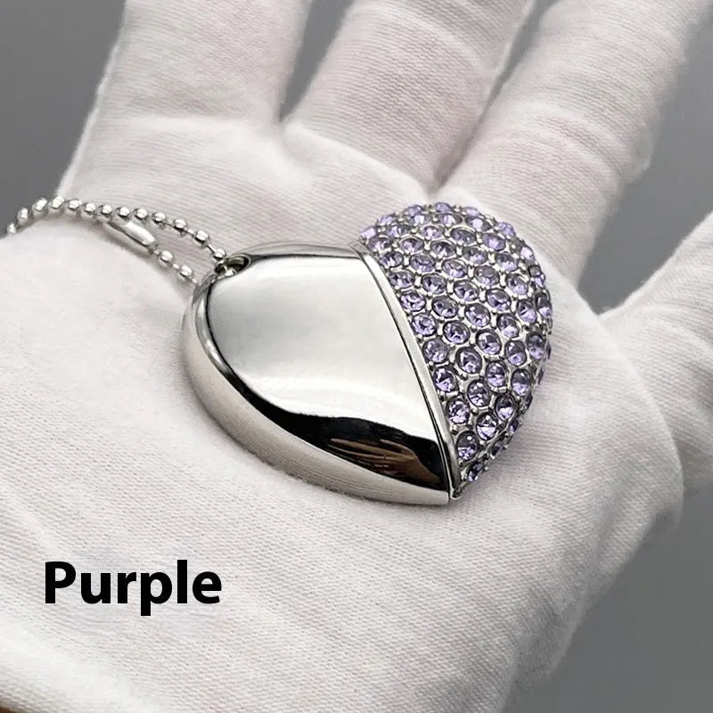 Blue heart-shaped USB flash drive with brick-inlaid pattern on metal body, showing USB connector.