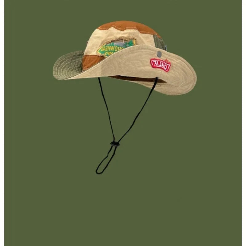 Army green cotton women's fisherman hat with hand-painted patchwork details and a flat top crown.