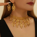 Gold alloy heart-shaped hollow necklace and matching earrings set on display with multiple hanging leaf ornaments
