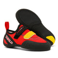 A pair of beginner rock climbing shoes with a velcro strap, shown in a black and red colour combination.