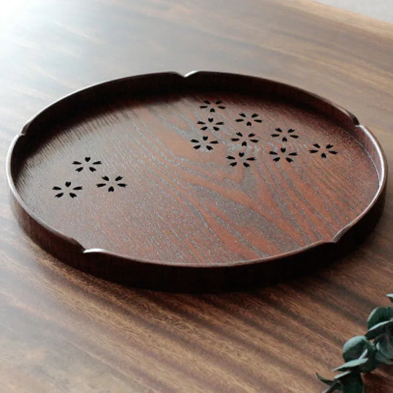 Wooden shallow plate with hollow sakura cherry blossom design, 30 cm diameter, for dessert serving.