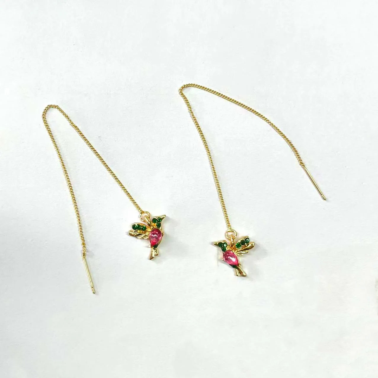 Long style women's earrings with a hanging bird design featuring mixed zirconium wings.