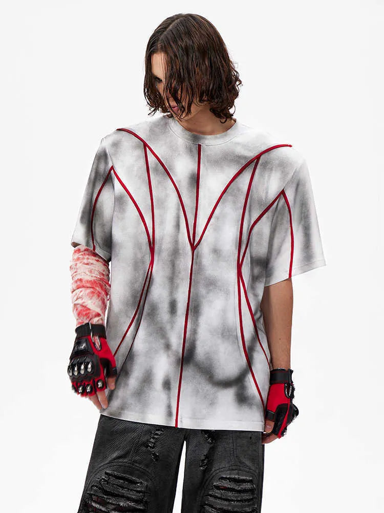 Padded shoulder short sleeve t-shirt with textured line patchwork design and round neck.