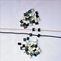 Black PA66 nylon wire management clips for automotive and electronic cable organisation