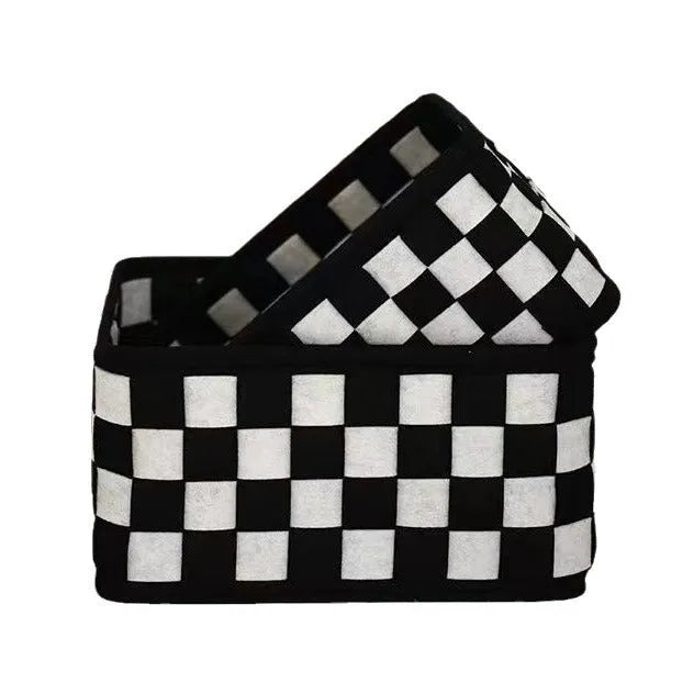 Checkerboard patterned foldable felt storage basket showing its woven texture and open-top design.