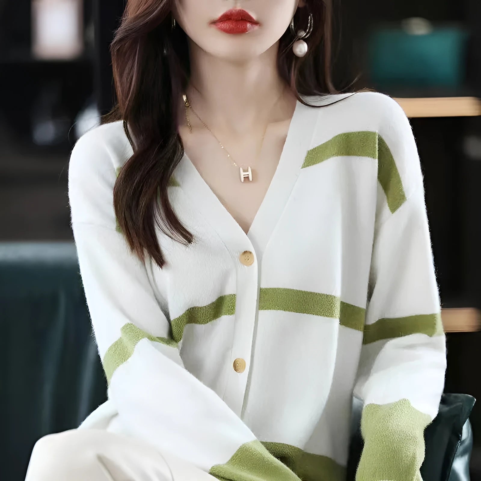 Women's slim-fit V-neck cardigan with 3D striped pattern and button front in assorted colours.