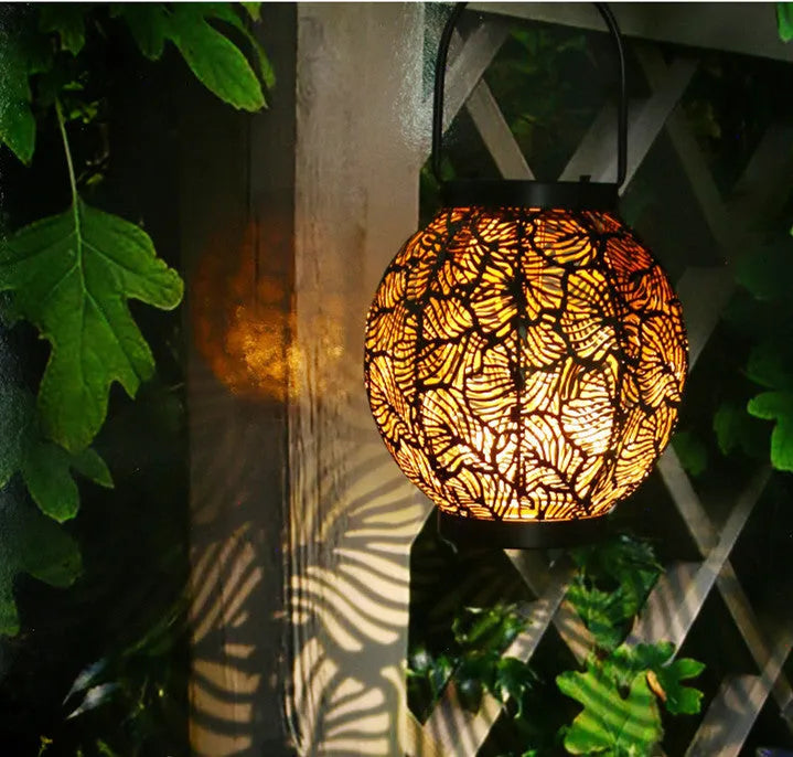 Solar outdoor courtyard hollow decorative iron portable lamp with warm white LED lighting