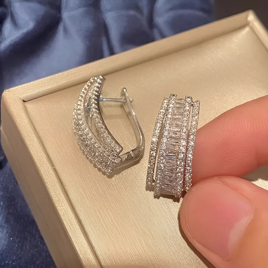 Geometric stud earrings with white gold colour finish and zircon inlaid decoration