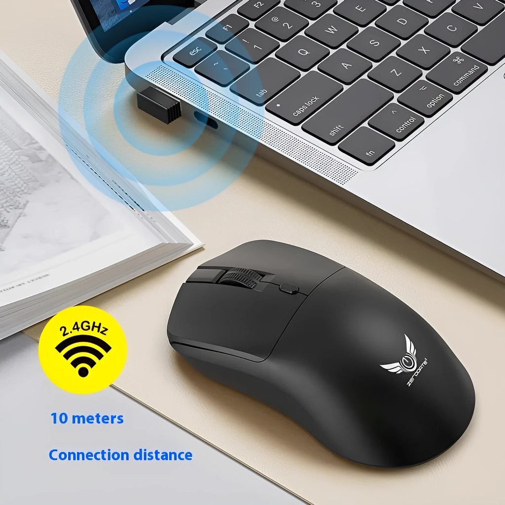 Black wireless mouse with three side buttons on a desk next to a laptop