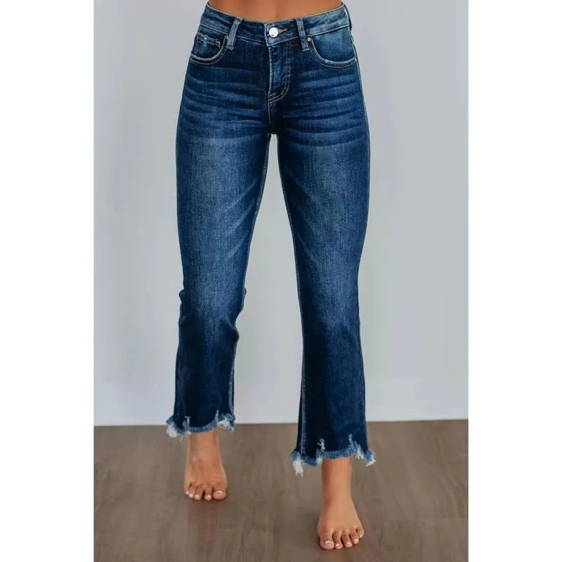 Women's casual denim jeans in solid dark blue with a hand-worn distressed finish.