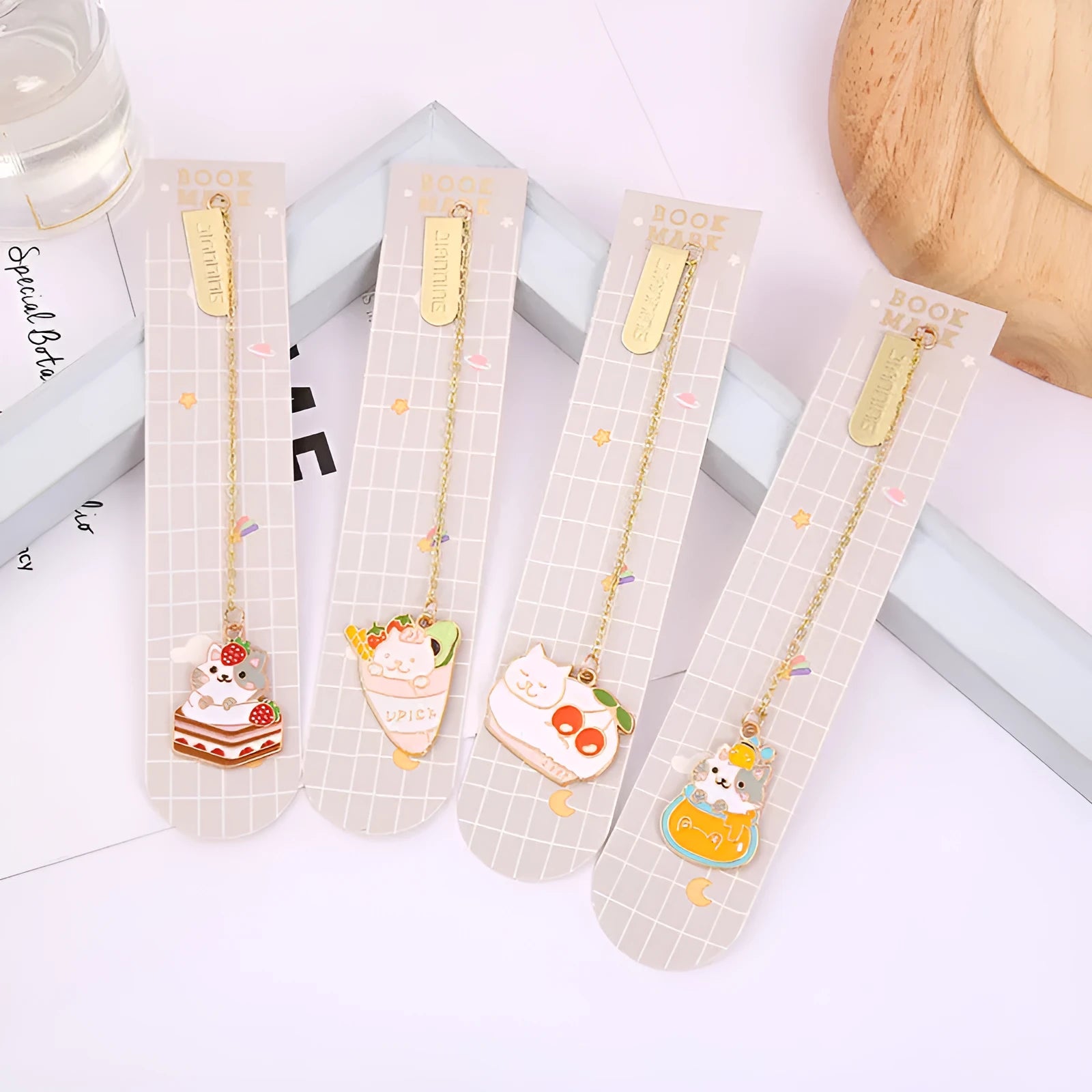 Jane Lime metal pendant cat cartoon bookmark in four colourful designs on a white background.