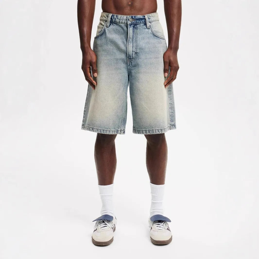 Men's light blue loose fit straight-leg denim jeans on white background