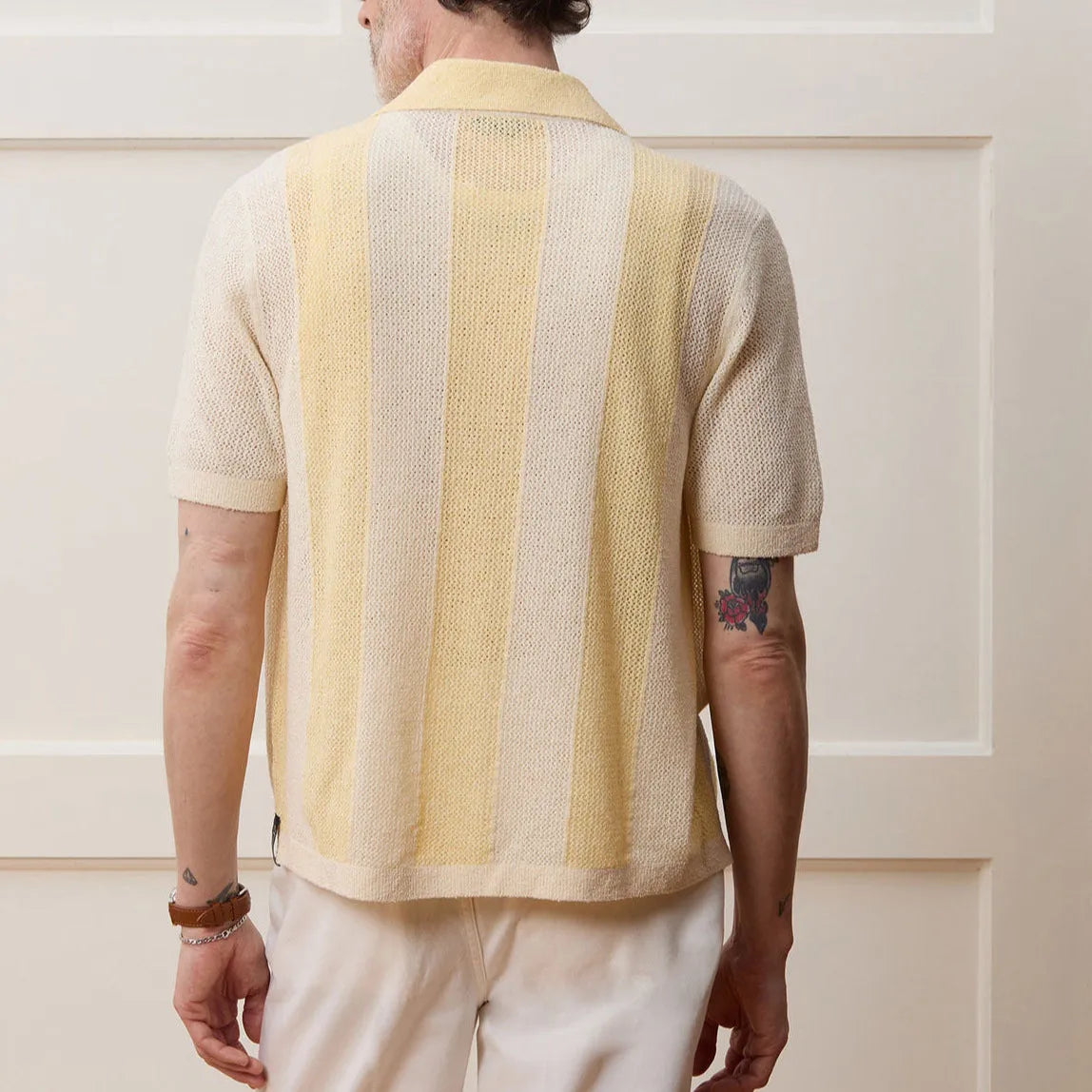 Hollow-out short-sleeved Tencel polo shirt in yellow with asymmetric design