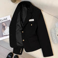 Women's black loose-fit short suit coat with long sleeves and pockets, shown on a hanger.