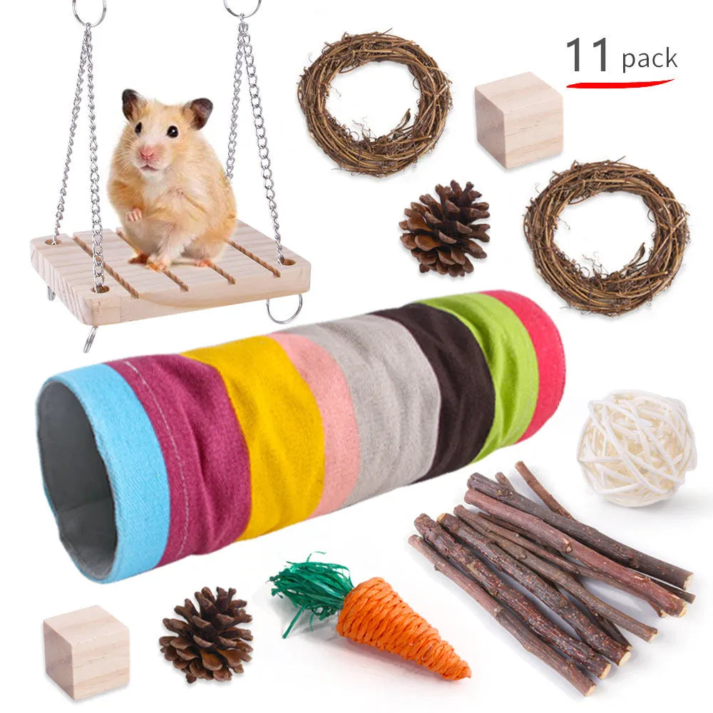 Assortment of natural wooden chew toys for small pets including balls and woven items on a straw mattress.