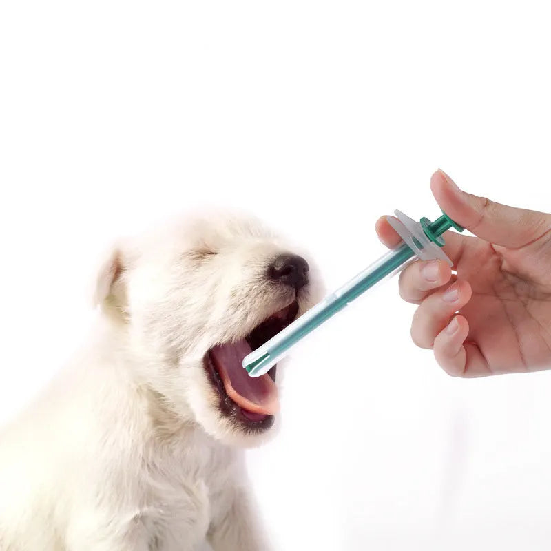Two silica gel pet pill shooters with soft tips for administering medicine to cats and dogs.