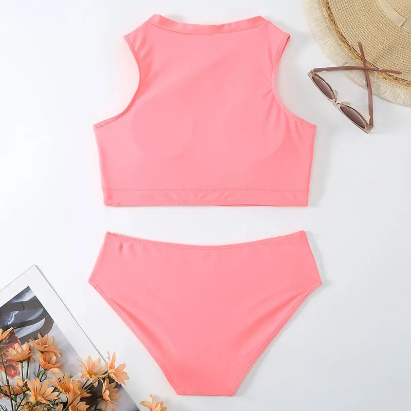 Pink high waist bikini swimsuit set with briefs and a bra on a mannequin.