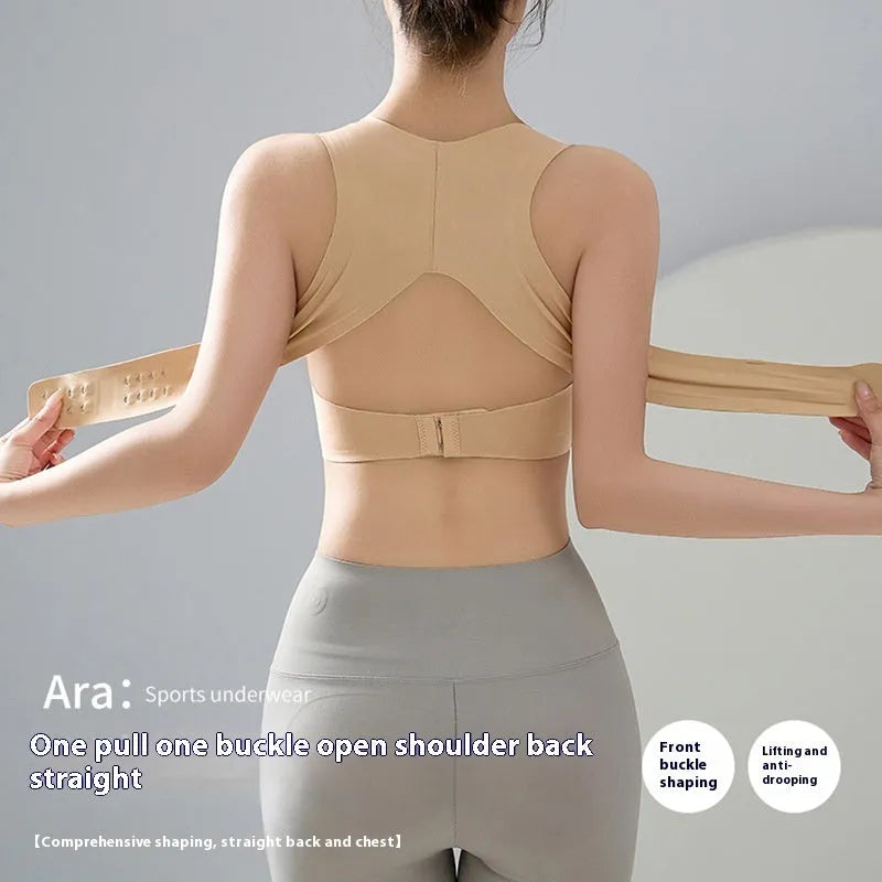 Women's black yoga bra with front buckle closure and supportive back design.