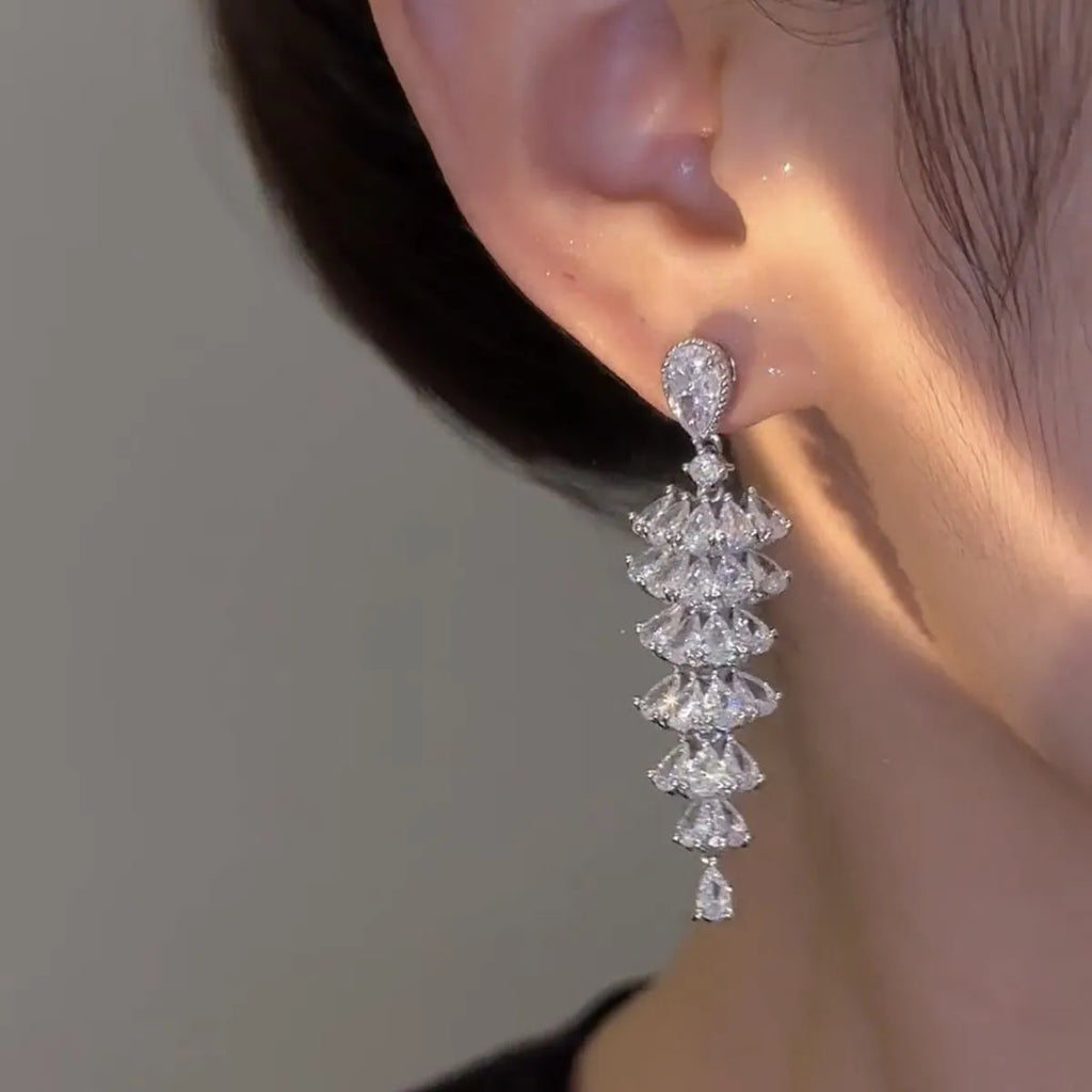 Silver pagoda-shaped Christmas tree drop earrings with sparkling zircon stones