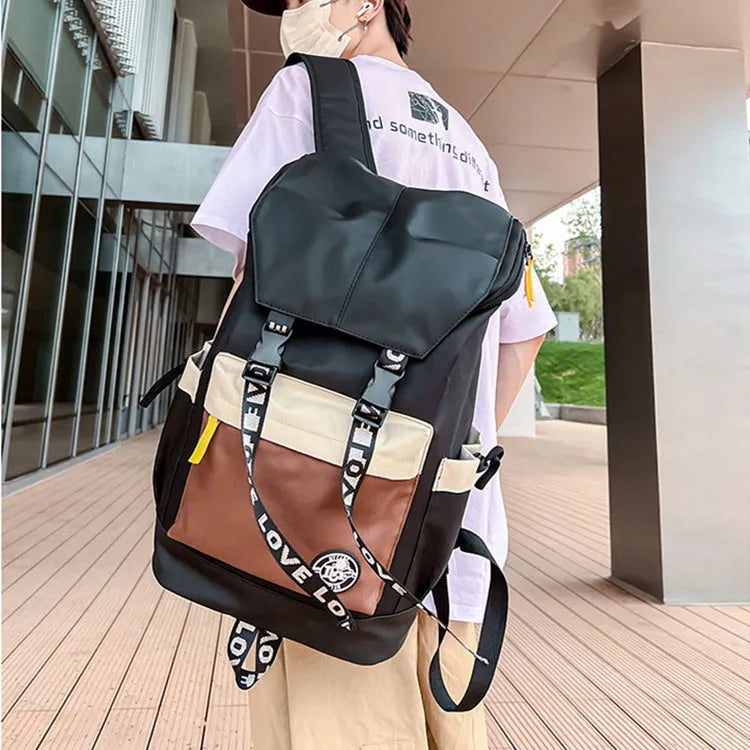 Oxford cloth student backpack showing three carrying methods in black, green and red colour options