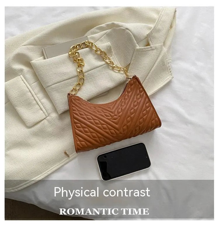 Brown pleated PU leather vertical square shoulder bag with a chain strap and soft handle.