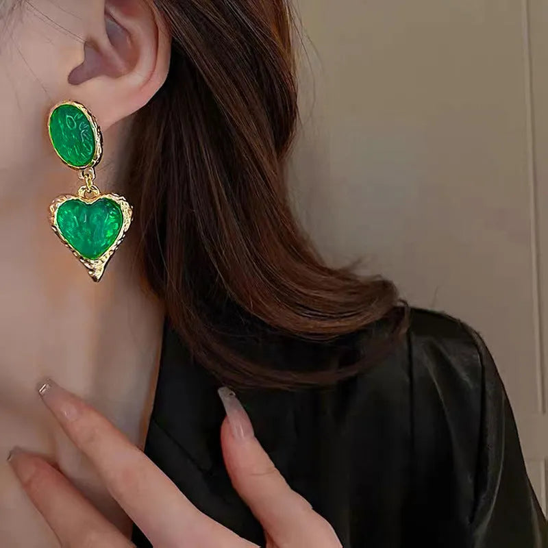 Silver needle pleated oval love heart alloy stud earrings in purple, red, green, and yellow-white.