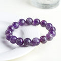 Natural Feather Amethyst bracelet with scattered beads in Snow Mountain purple colour on white background