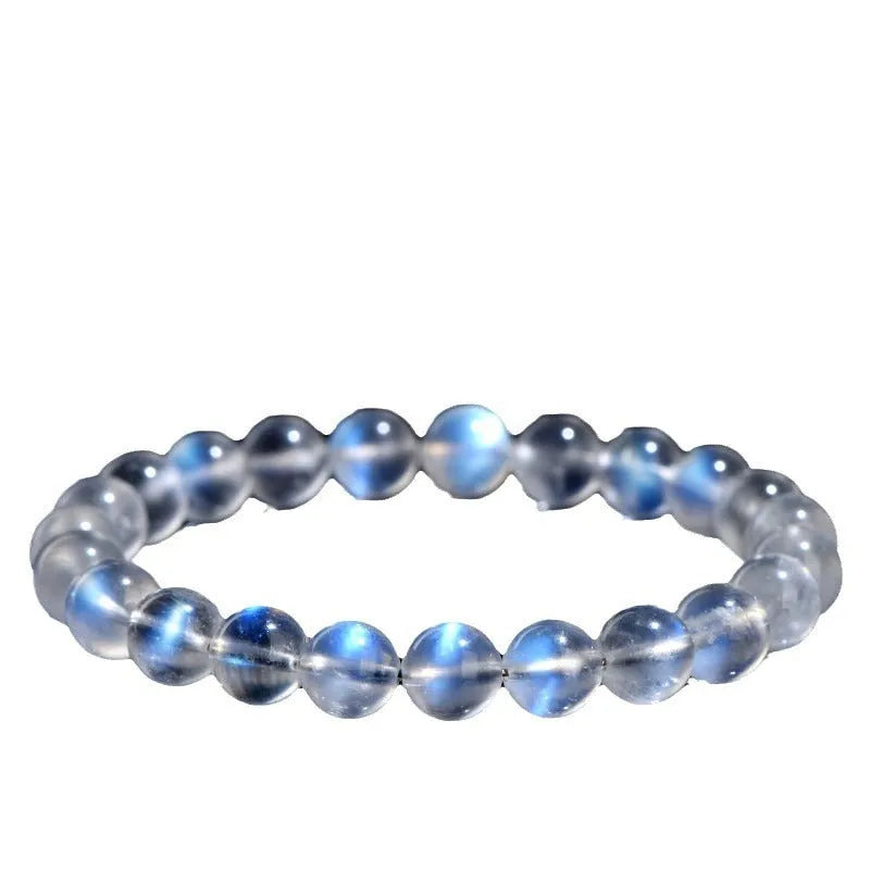 Natural cream body blue moonlight crystal bracelet with matte finish on a wrist.