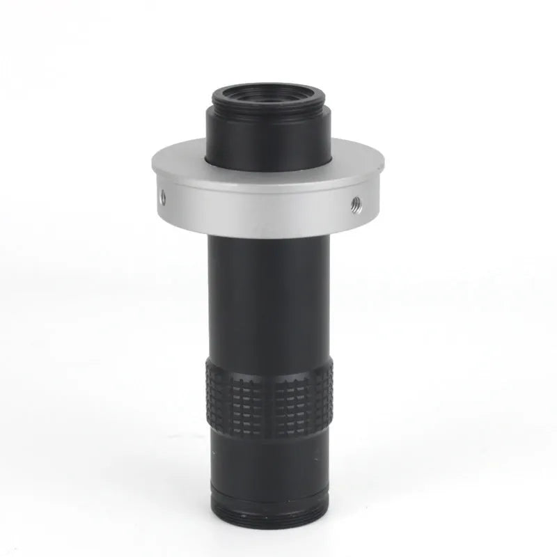Black industrial monocular camera lens for 0.1-1.3X magnification with 60-300mm working distance.