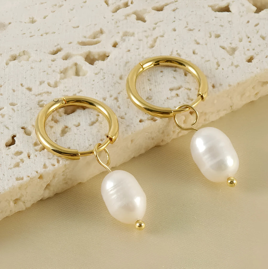 Gold geometric women's earrings with a central pearl, made from stainless steel and titanium steel.