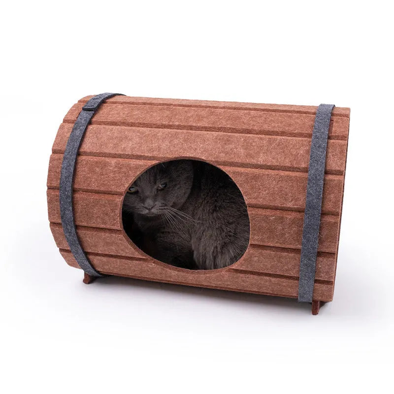 Assembled taupe and cream wine barrel shaped polyester fiber felt cat bed with three panels and two binding straps.