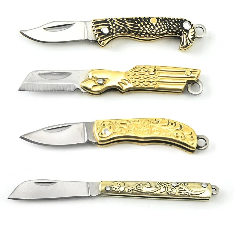Brass mini folding knife with 3cm blade and keychain pendant on brass ring, 50mm full length model shown