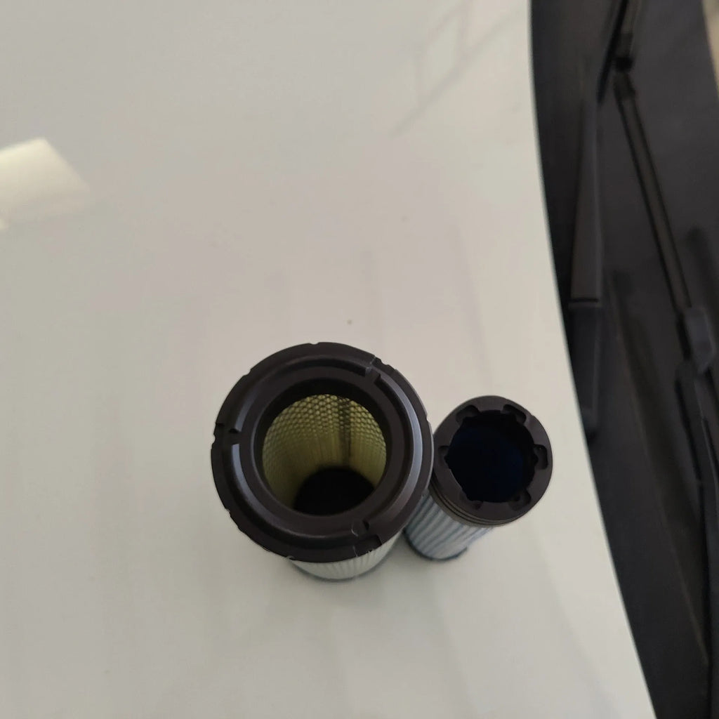 Donaldson 1027 model air filter with straight head and elbow connection, showing folded filter element.